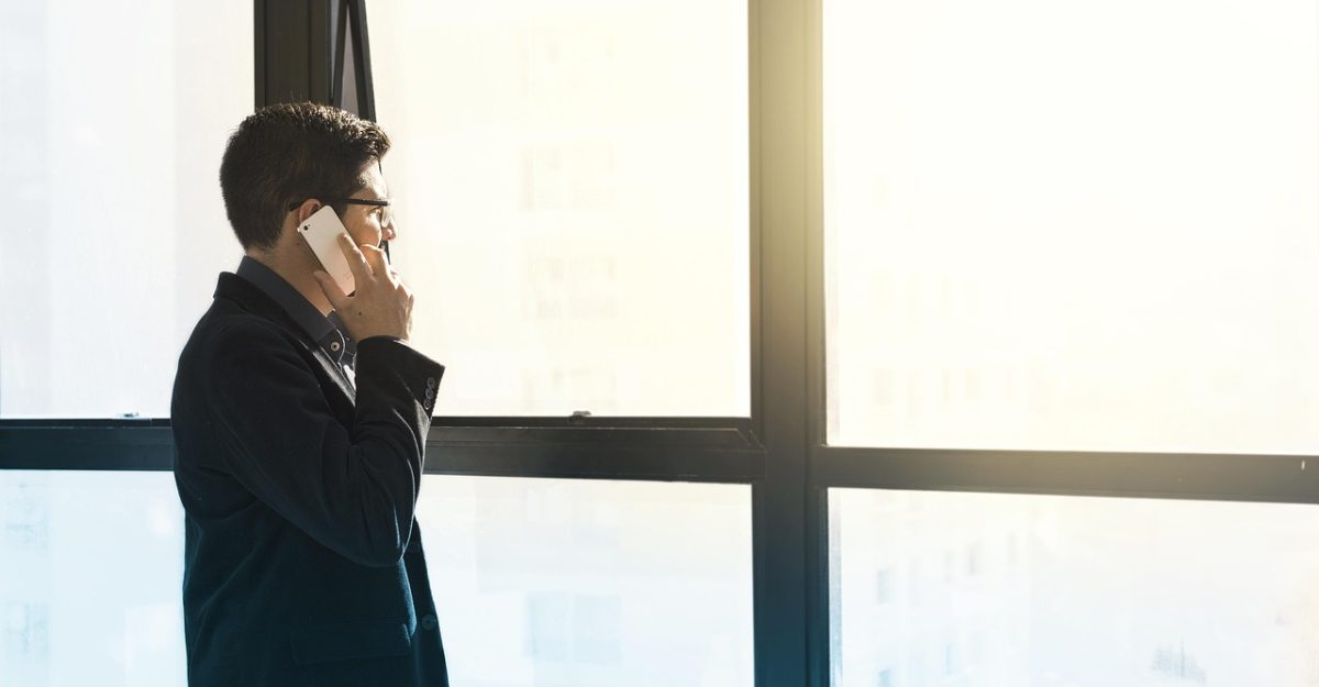 Man, cell phone, tuxedo — Best Practices for Window Installation in Birmingham