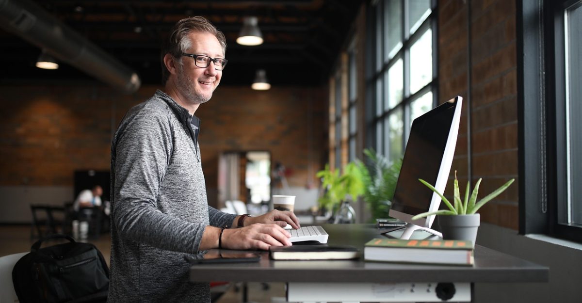Office desk, man, business — Dr. Joel Durinka Providing Guidance on Two-Point Compression Ultrasound for Improved Diagnosis