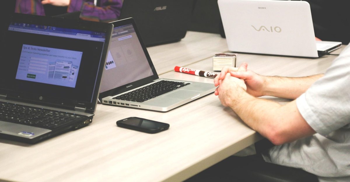 Laptops, meeting, businessmen — Skin Health as a Reflection of Holistic Wellness: Insights from Dr Wayne Lajewski
